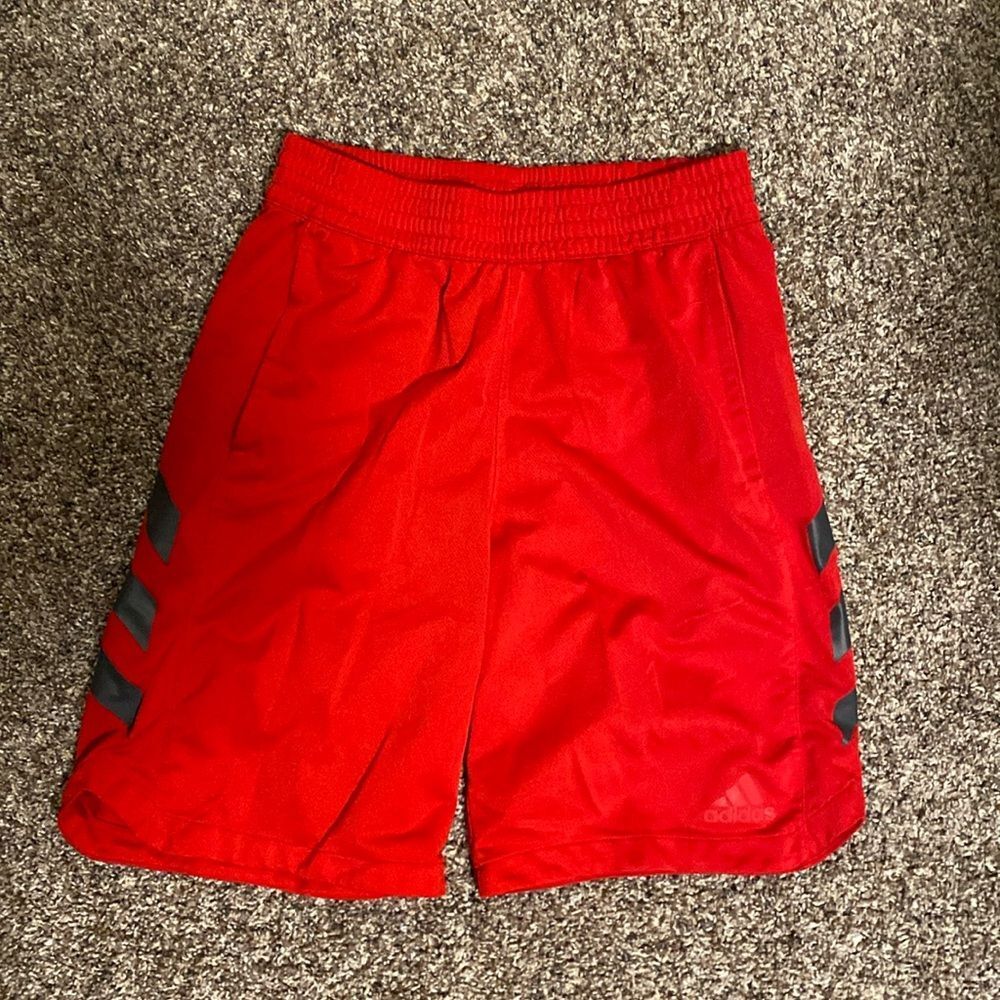 Red Adidas athletic shorts